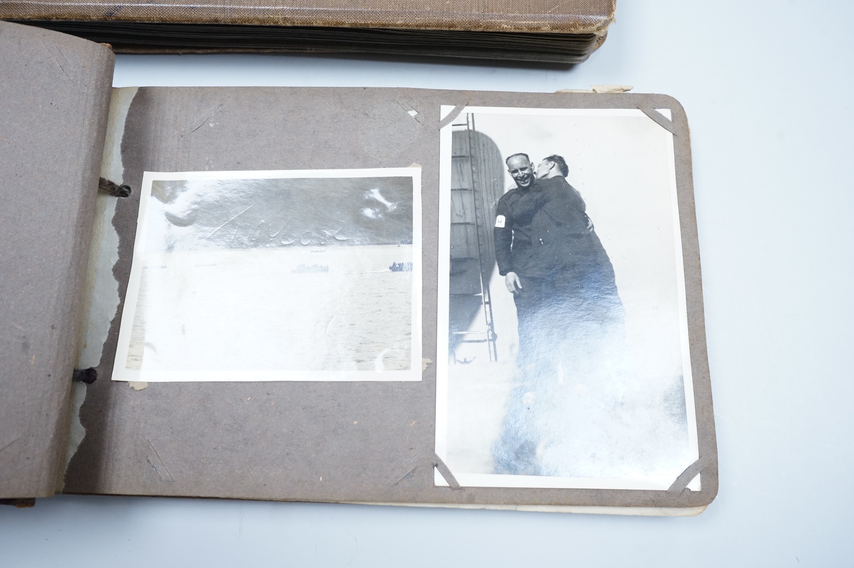 Two WWII naval photo albums, containing an archive of 1940s photographs of the Russian convoy in the Barents Sea, a ship’s concert at Scarpa Flow, a variety of Royal Naval vessels and some aircraft, images aboard HMS Peg